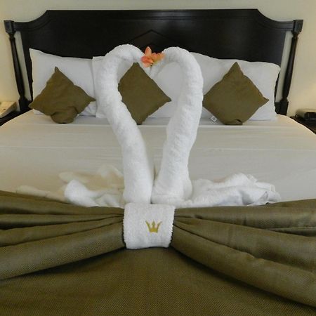 Hotel Victoria Mérida Dış mekan fotoğraf A bed with a towel swan